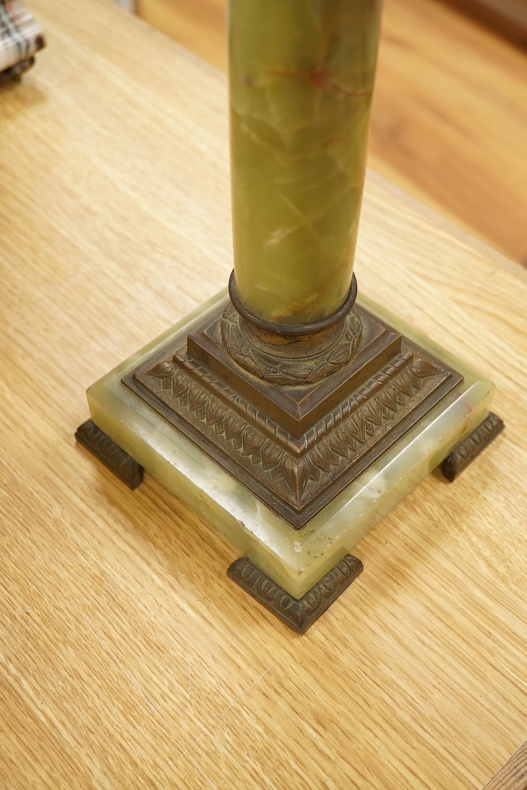 An onyx oil lamp with glass reservoir, 82cm high